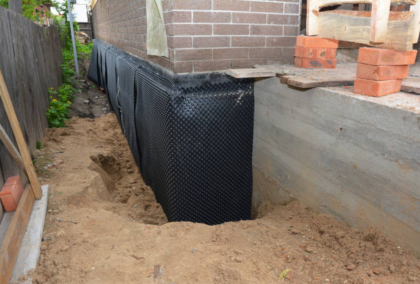 Happy homeowners after waterproofing job in Sonyea
